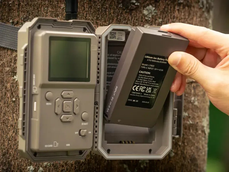 Inserting a rechargeable lithium battery into a GardePro X66 Pro cellular trail camera