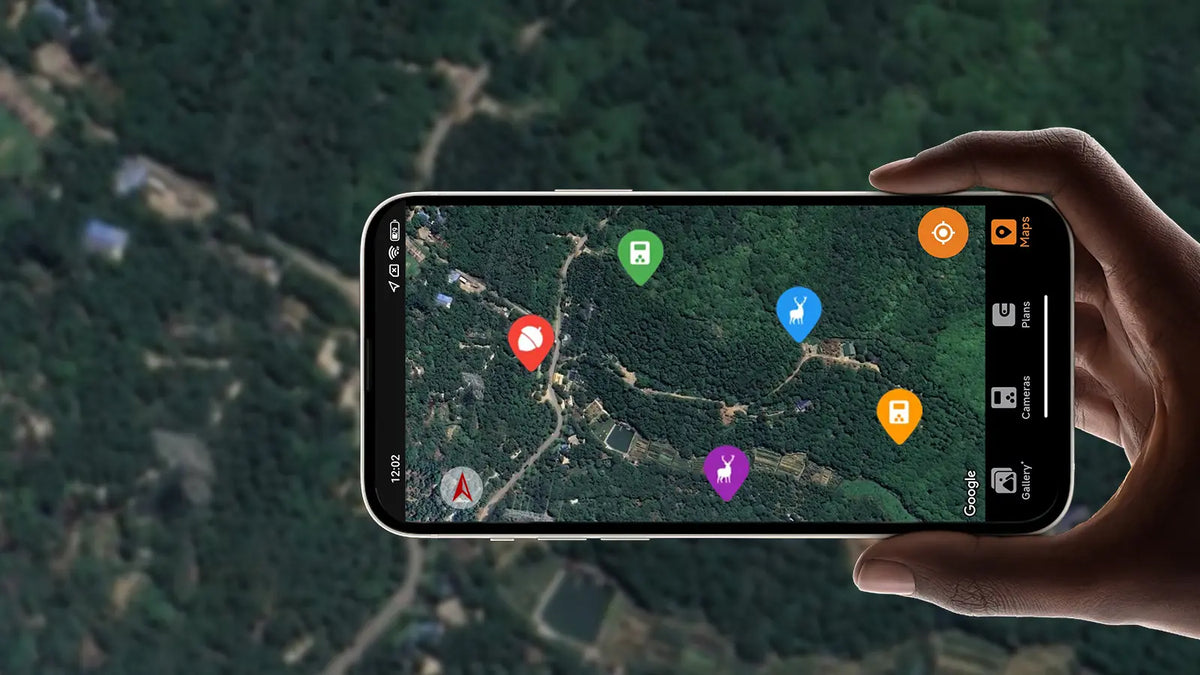GardePro app displaying a GPS map to track the location of multiple GardePro X50S cellular trail cameras in a wooded area