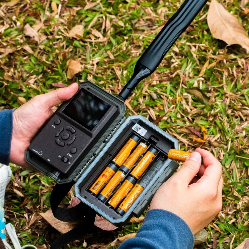 Installing AA batteries into a GardePro X20WF cellular trail camera for powering outdoor deployments