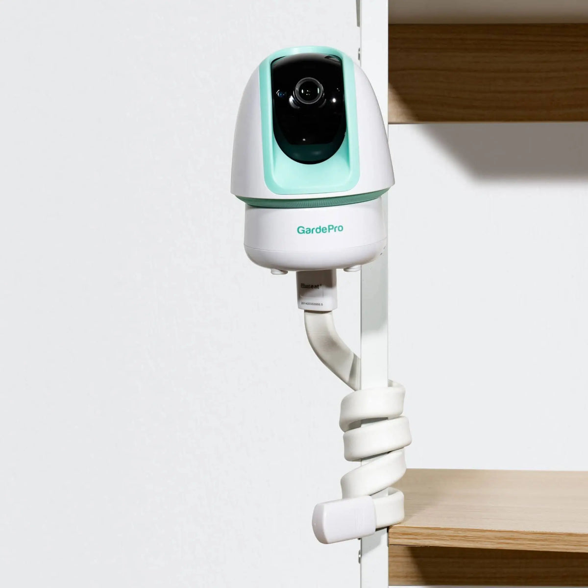 GardePro baby monitor camera secured to furniture using a flexible twist mount.